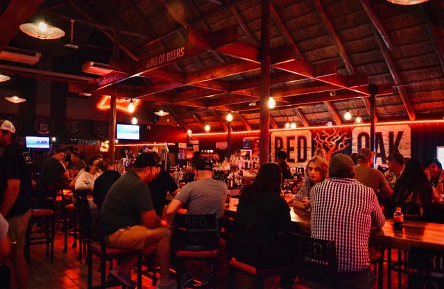 The busy Red Oak interior bathed in red light.